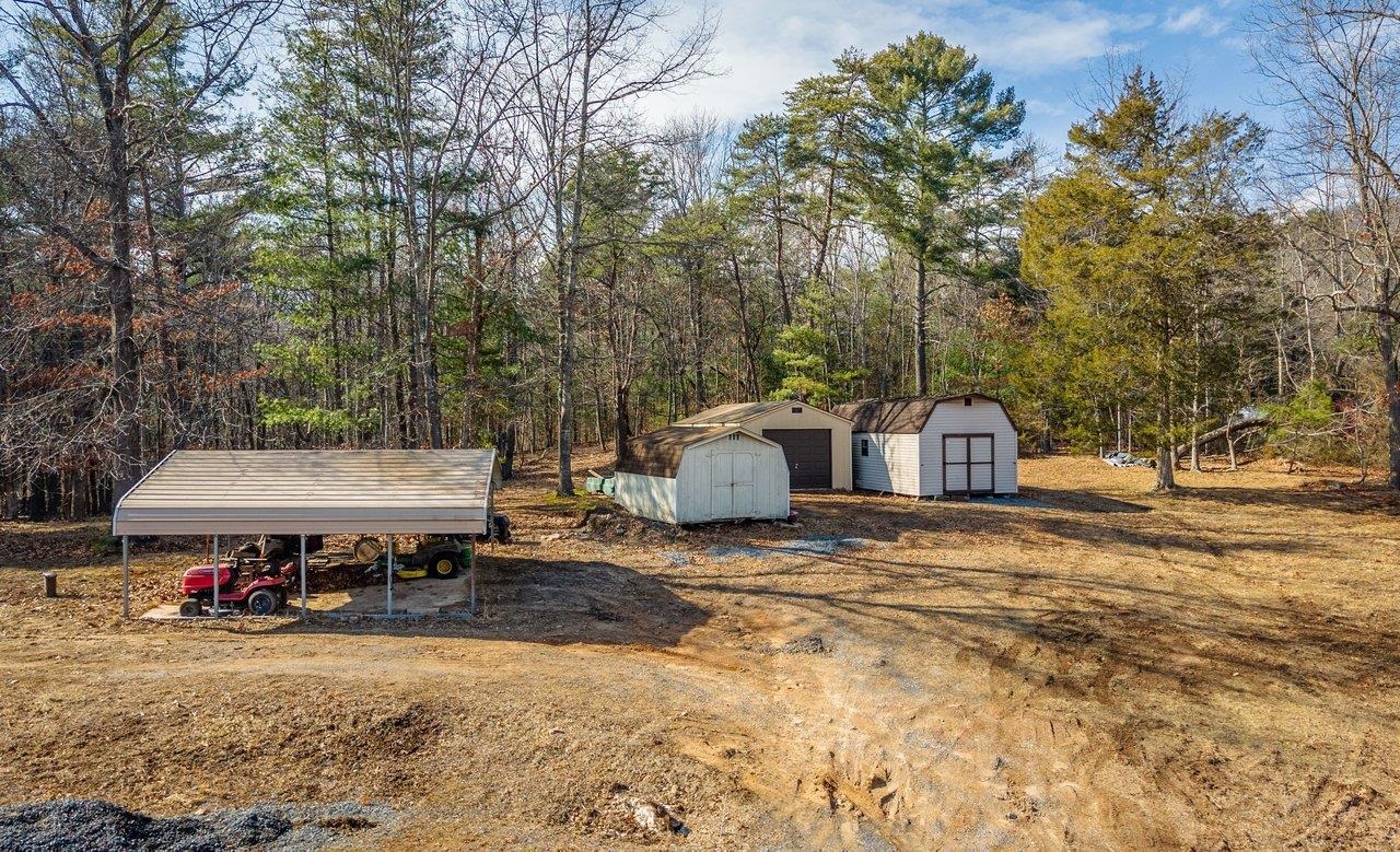10677 Allman Road Dayton, VA 22821 - Photo 44 of 57 a view of a house with a yard and sitting area