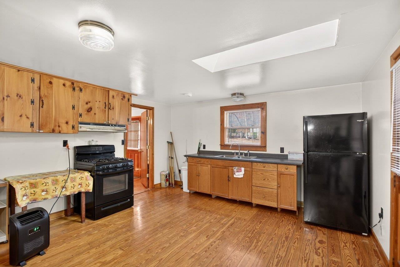 10677 Allman Road Dayton, VA 22821 - Photo 5 of 57 a kitchen with stainless steel appliances granite countertop a refrigerator a stove and a wooden floors