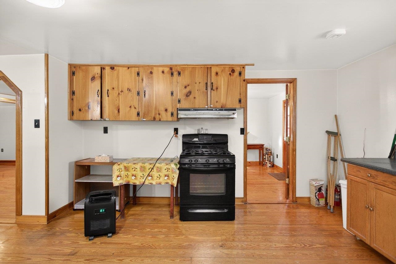 10677 Allman Road Dayton, VA 22821 - Photo 7 of 57 a kitchen with stainless steel appliances granite countertop a stove and a refrigerator