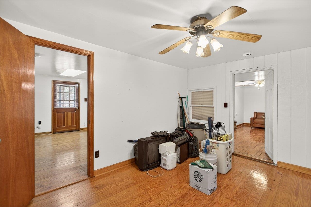 10677 Allman Road Dayton, VA 22821 - Photo 10 of 57 a living room with furniture and a chandelier