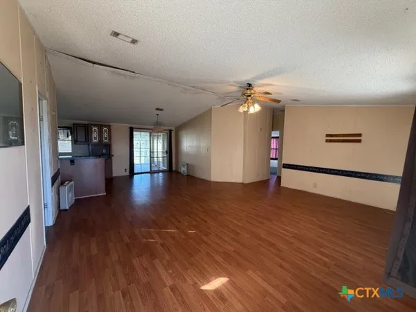 a view of a livingroom with wooden floor