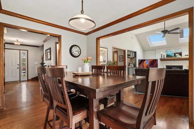 982 Plum Tree Road Fox River Grove, IL 60021 - Photo 13 of 48 a view of a dining room with furniture and wooden floor