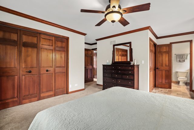 982 Plum Tree Road Fox River Grove, IL 60021 - Photo 23 of 48 a bedroom with a bed and a dresser
