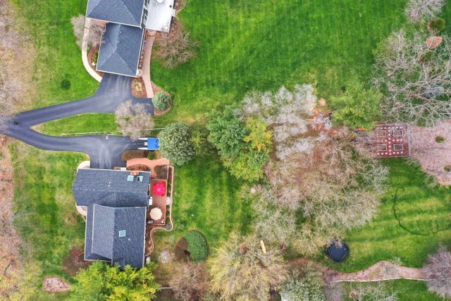 982 Plum Tree Road Fox River Grove, IL 60021 - Photo 45 of 48 an aerial view of a house with a yard and lake view