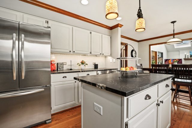 982 Plum Tree Road Fox River Grove, IL 60021 - Photo 8 of 48 a kitchen with stainless steel appliances granite countertop a sink a refrigerator and a refrigerator