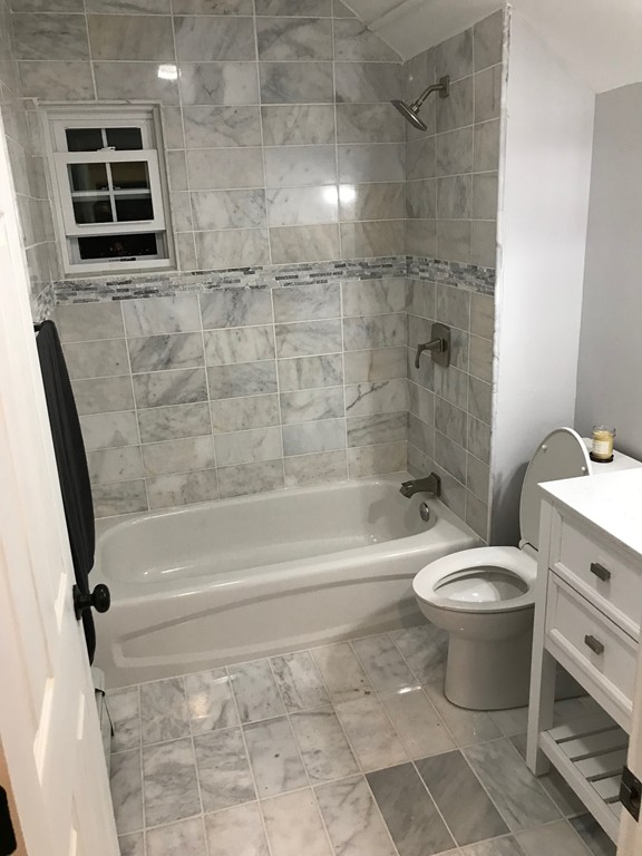 18 Park Street Boston, MA 02136 - Photo 12 of 20 a bathroom with a toilet and a shower