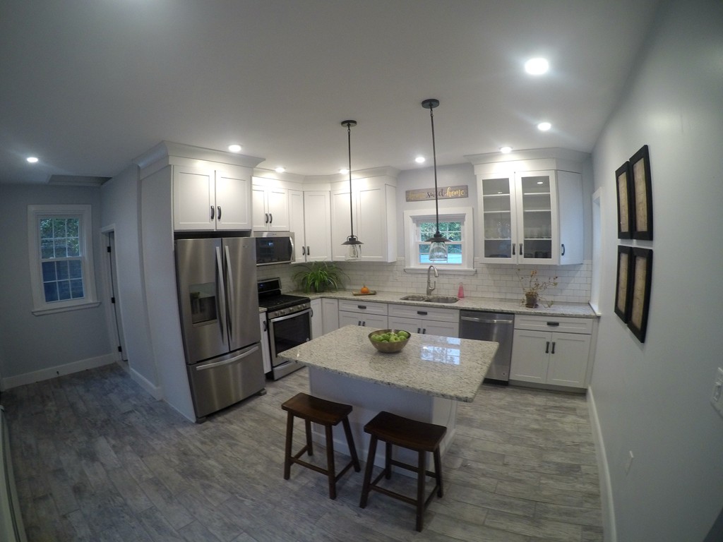 18 Park Street Boston, MA 02136 - Photo 4 of 20 a kitchen with refrigerator and chairs