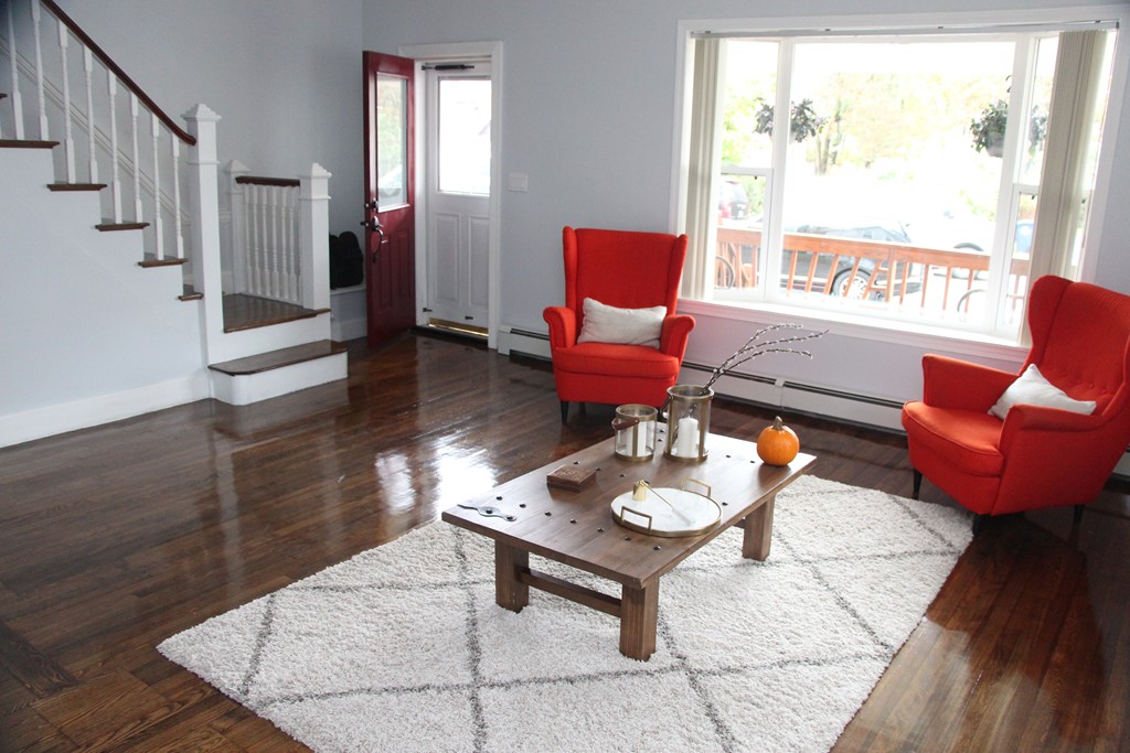 18 Park Street Boston, MA 02136 - Photo 7 of 20 a living room with furniture and a window