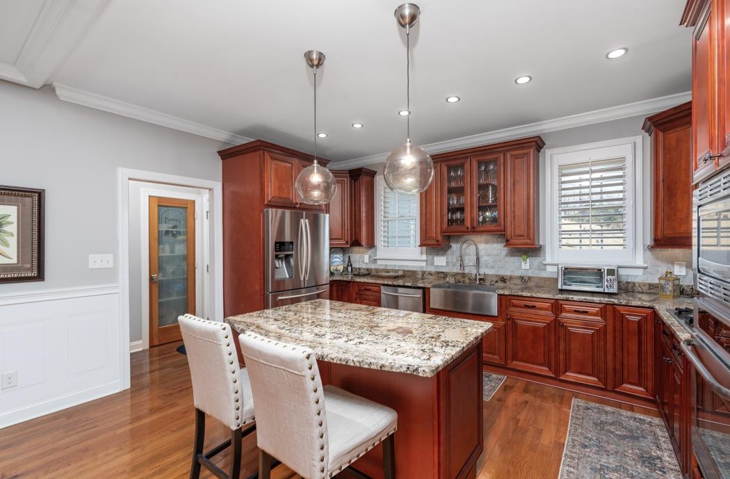 230 Koogler Trail Raphine, VA 24472 - Photo 26 of 61 a kitchen with granite countertop kitchen island dining table and stainless steel appliances