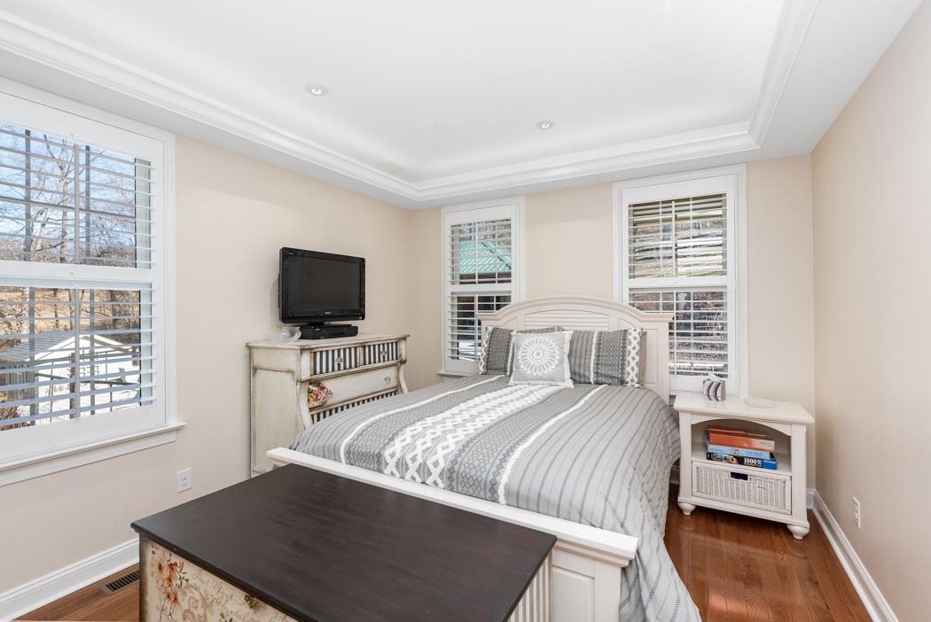 230 Koogler Trail Raphine, VA 24472 - Photo 45 of 61 a bedroom with a bed and a flat screen tv