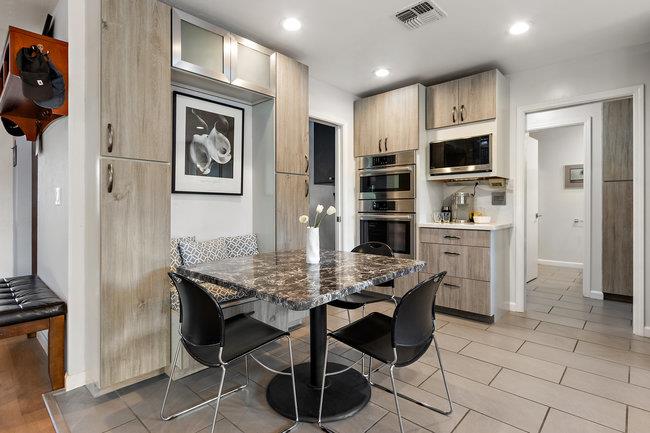 2549 Morley Way Sacramento, CA 95864 - Photo 15 of 44 a kitchen with stainless steel appliances kitchen island granite countertop a refrigerator and cabinets