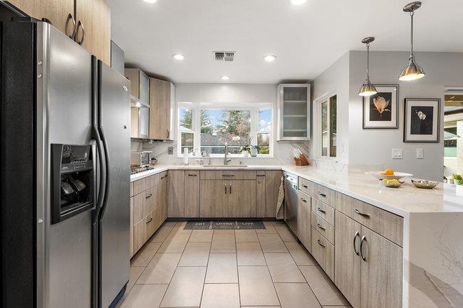 2549 Morley Way Sacramento, CA 95864 - Photo 16 of 44 a kitchen with stainless steel appliances kitchen island granite countertop a refrigerator a sink dishwasher a oven with white cabinets and wooden floor