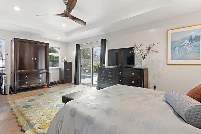 2549 Morley Way Sacramento, CA 95864 - Photo 22 of 44 a large bedroom with a bed and a flat screen tv