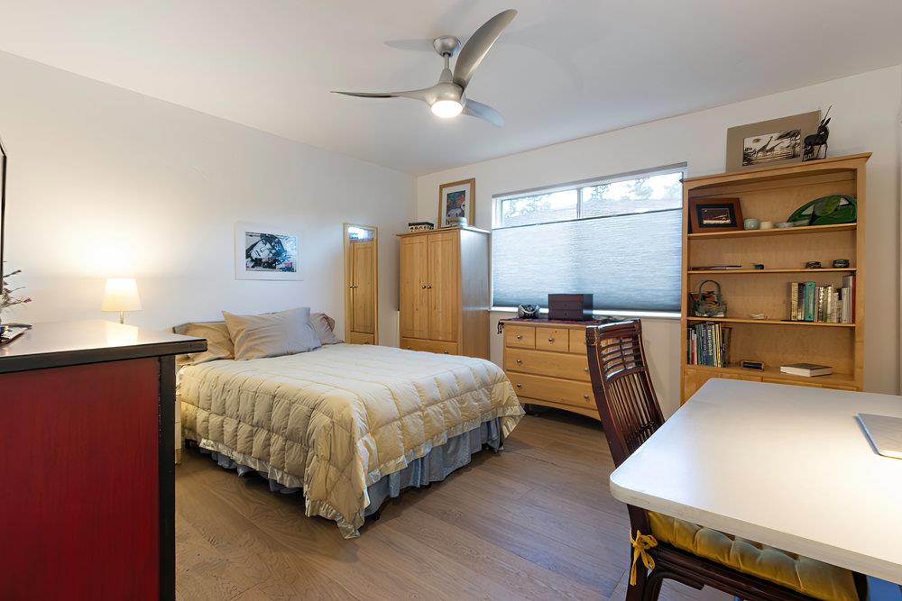 2549 Morley Way Sacramento, CA 95864 - Photo 30 of 44 a bedroom with a bed and a flat tv screen on dresser