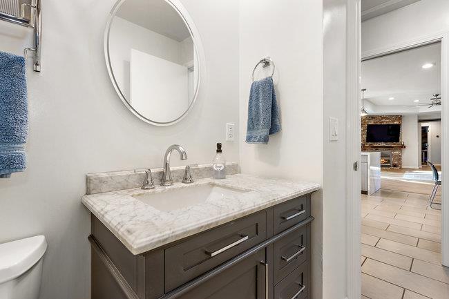 2549 Morley Way Sacramento, CA 95864 - Photo 34 of 44 a bathroom with a granite countertop sink and a mirror