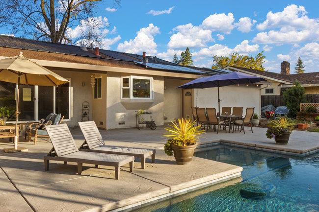 2549 Morley Way Sacramento, CA 95864 - Photo 37 of 44 a view of a patio with dining table and chairs with wooden floor and fence