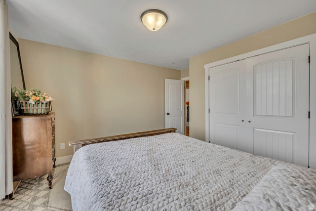 3054 West Ridgeline Road Stockton, UT 84071 - Photo 25 of 88 Bedroom with a closet and baseboards