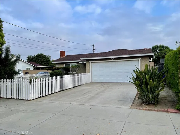 a front view of a house with garage