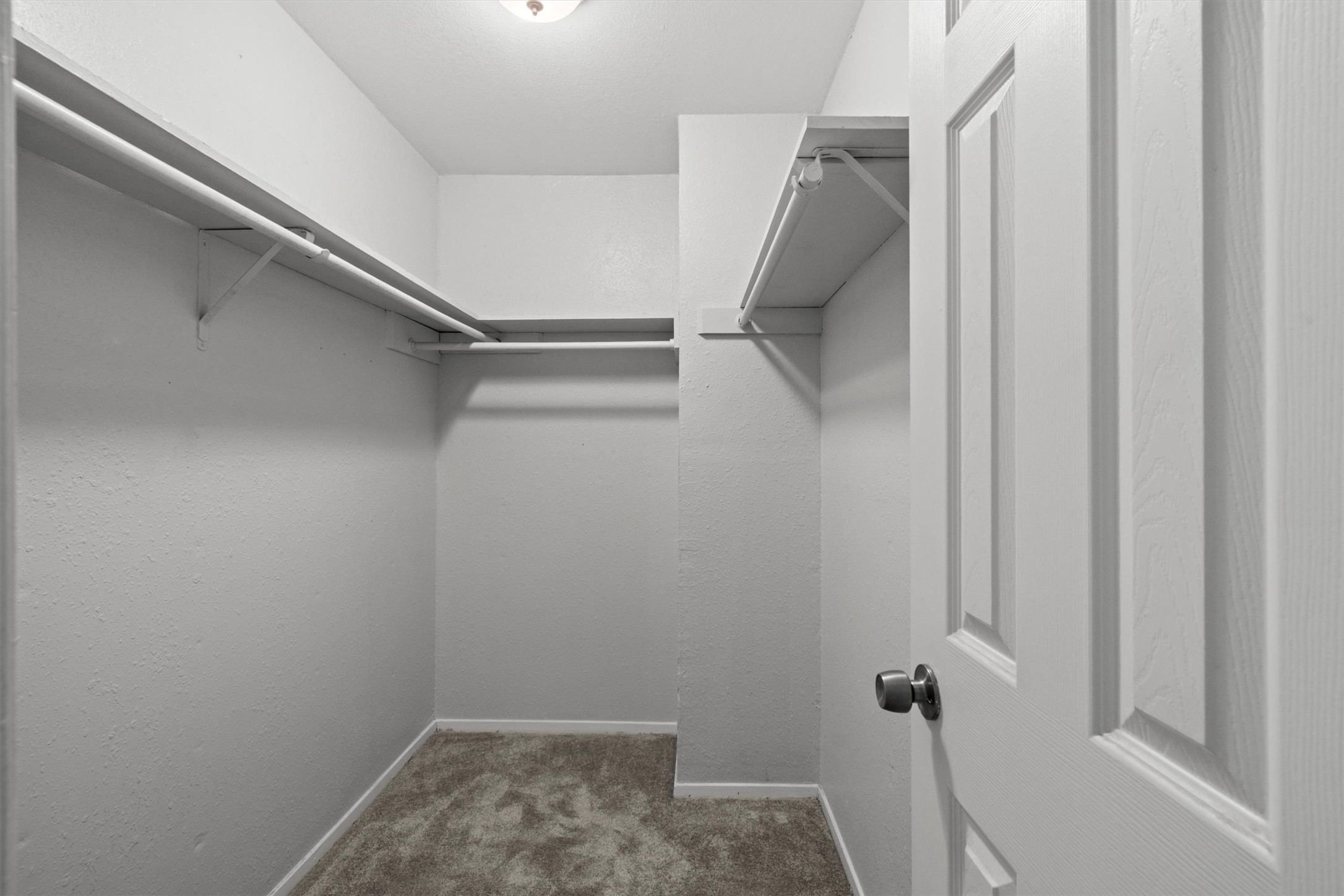 3627 Menchaca Road, Unit 204 Austin, TX 78704 - Photo 19 of 23 Functional walk-in closet offers ample storage with sturdy shelving and hanging rods.