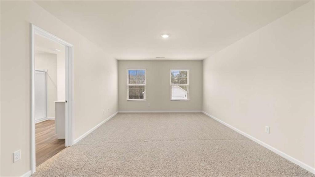 100 Planters Row Perry, GA 31069 - Photo 12 of 37 an empty room with windows