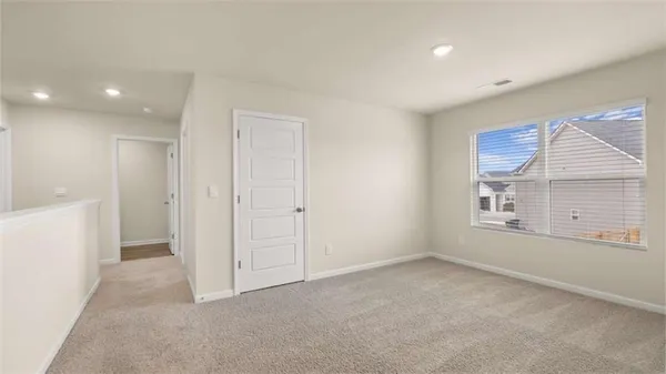 a view of an empty room with a window