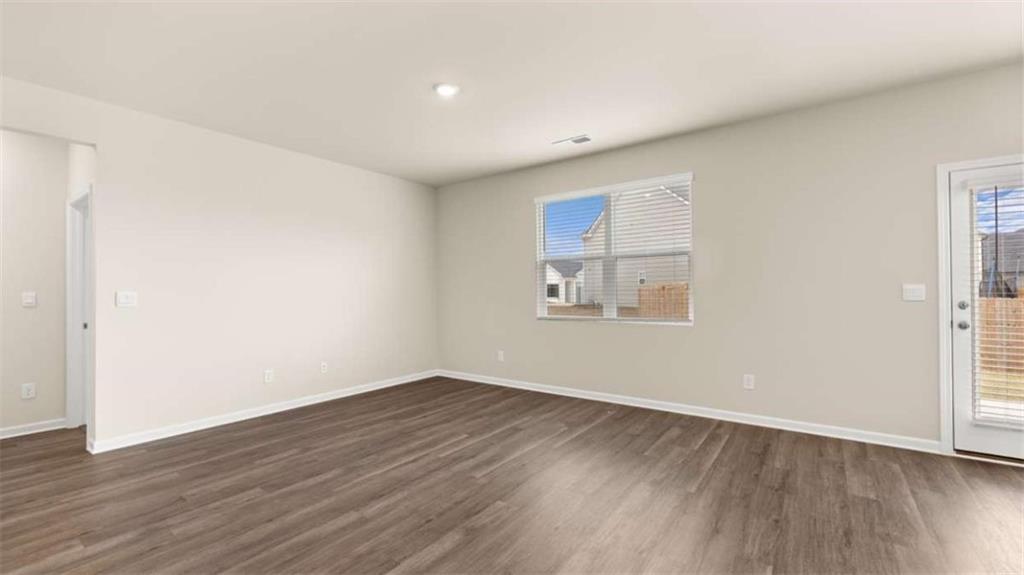 100 Planters Row Perry, GA 31069 - Photo 27 of 37 an empty room with wooden floor and windows