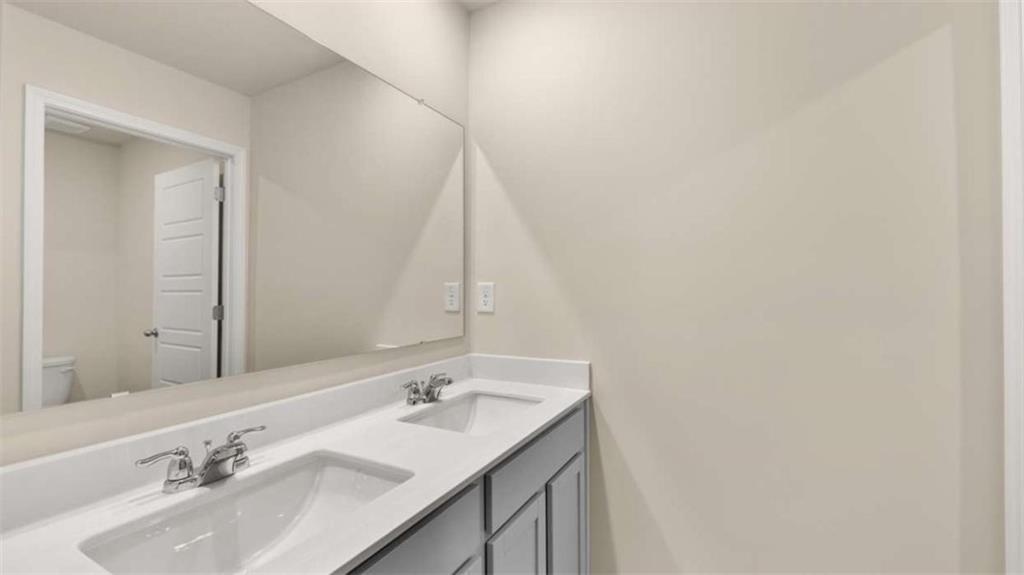 100 Planters Row Perry, GA 31069 - Photo 29 of 37 a bathroom with a sink and a mirror
