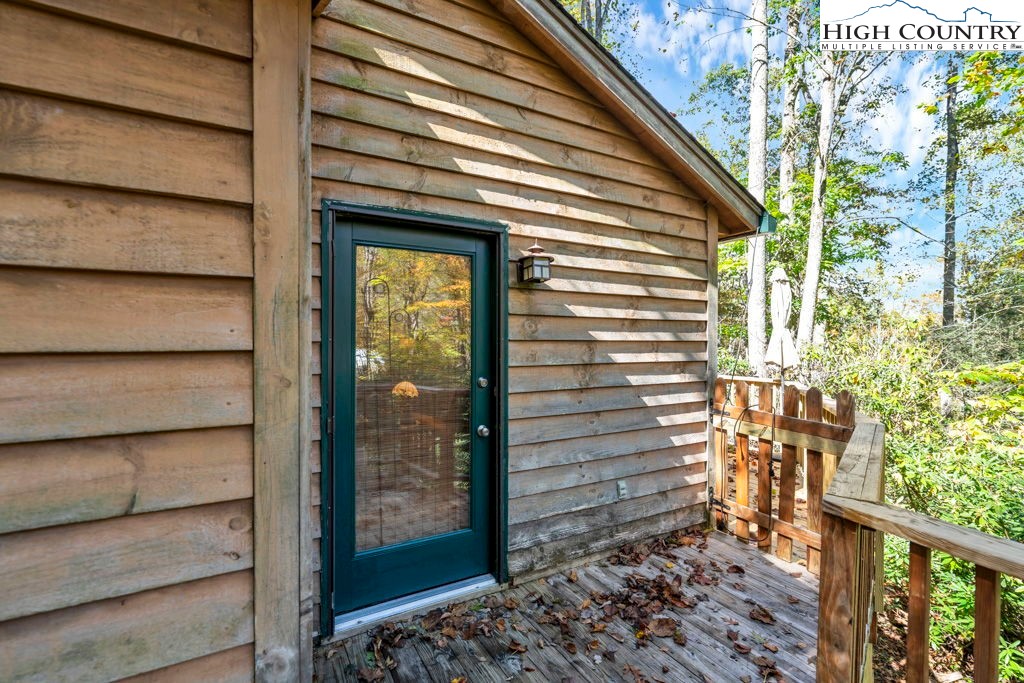 180 Wild Blackberry Hill Road Boone, NC 28607 - Photo 28 of 30 a view of a house with a door and wooden floor