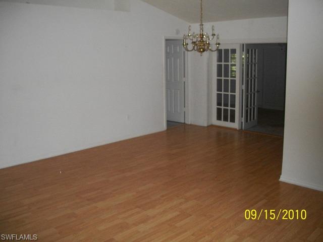 240 9th Street Southwest Naples, FL 34117 - Photo 2 of 8 a view of a room with a ceiling fan and window