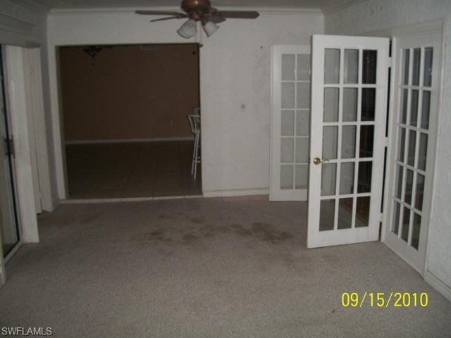 240 9th Street Southwest Naples, FL 34117 - Photo 5 of 8 a view of an empty room with a window