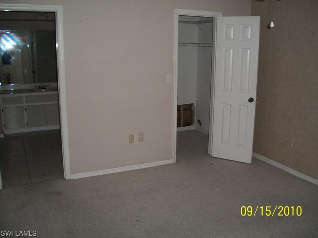 240 9th Street Southwest Naples, FL 34117 - Photo 6 of 8 an empty room that has a bathroom