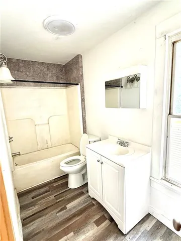a bathroom with a sink a toilet and a bathtub