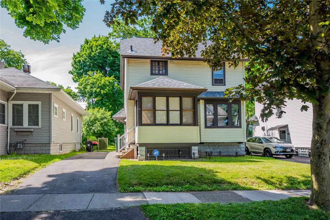 Traditional Rochester colonial on a tree lined str