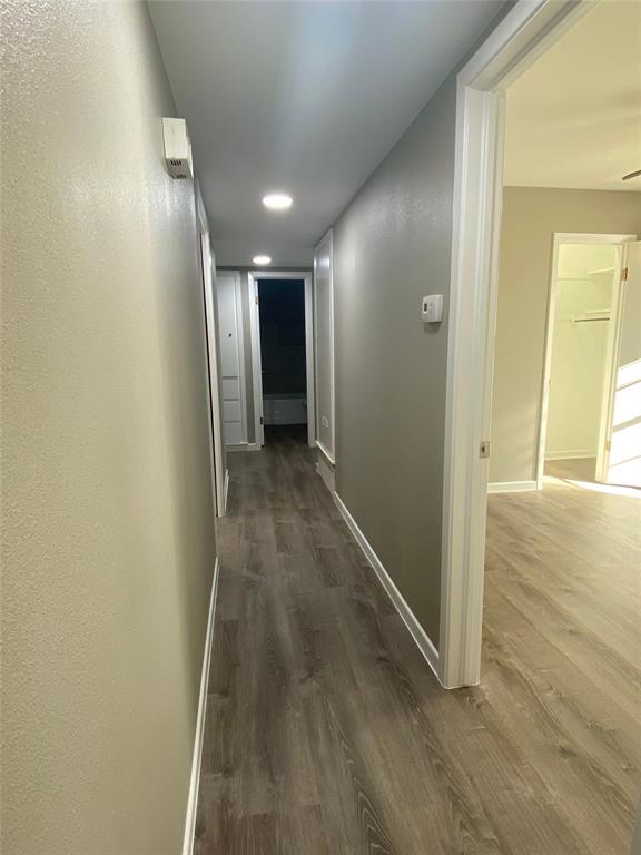 1445 West Ball Street Weatherford, TX 76086 - Photo 11 of 13 a view of hallway with wooden floor