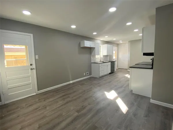 a view of a kitchen with a sink and a window