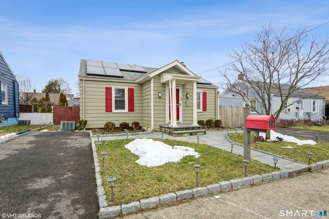 a front view of a house with yard
