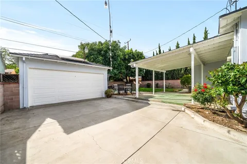 a view of a house with a yard and plants