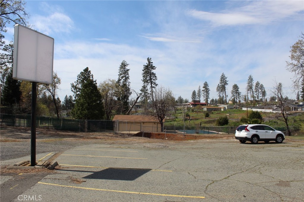 6047 Clark Road Paradise, CA 95969 - Photo 5 of 14 a view of a cars parked in front of a building