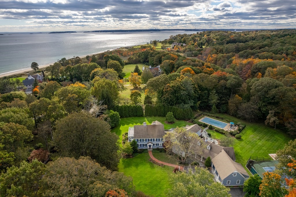 an aerial view of a house with a lake view