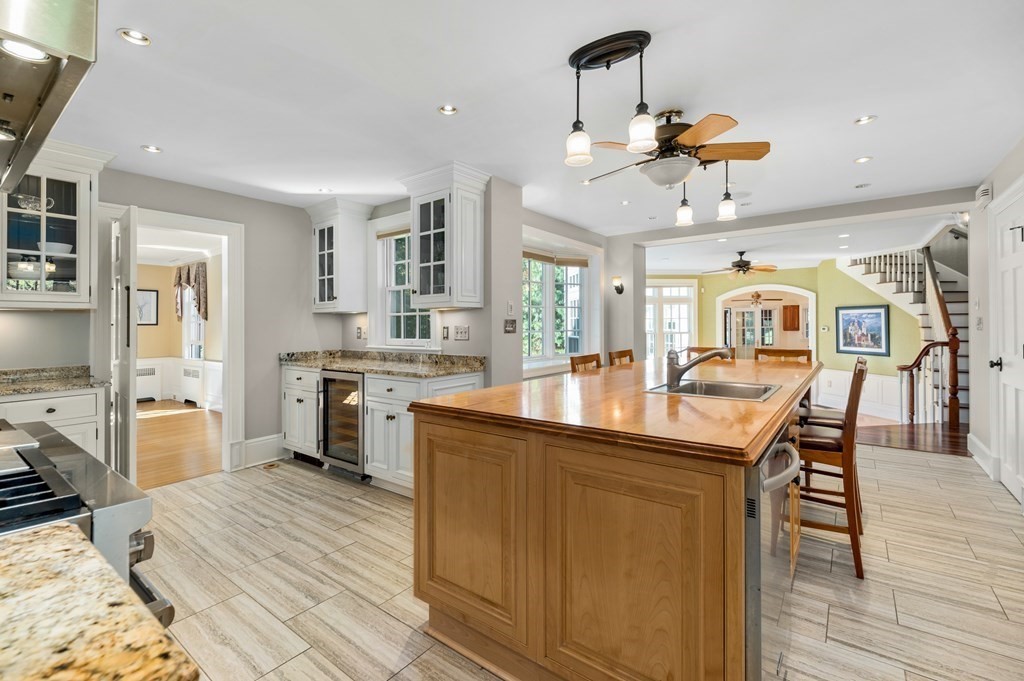 25 Haven Way Beverly, MA 01915 - Photo 12 of 42 a kitchen with stainless steel appliances granite countertop a sink stove and refrigerator