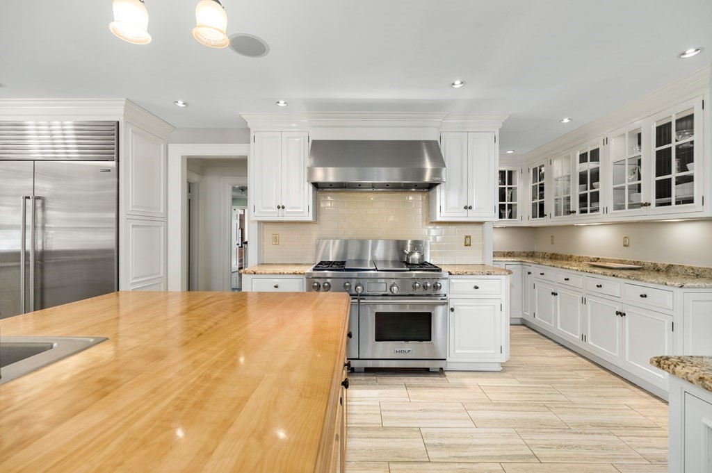 25 Haven Way Beverly, MA 01915 - Photo 13 of 42 a kitchen with stainless steel appliances granite countertop a stove a sink and a refrigerator