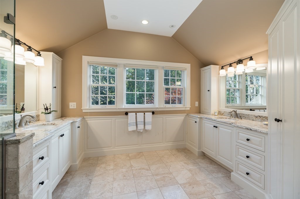 25 Haven Way Beverly, MA 01915 - Photo 19 of 42 a large white bathroom with a granite countertop sink mirror and a bathtub
