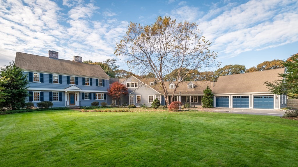 25 Haven Way Beverly, MA 01915 - Photo 2 of 42 a front view of a building with a garden