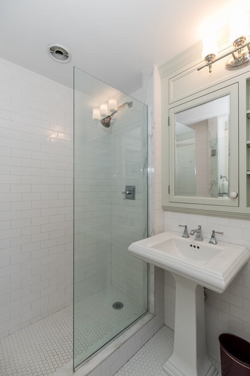 25 Haven Way Beverly, MA 01915 - Photo 22 of 42 a bathroom with a shower sink and mirror