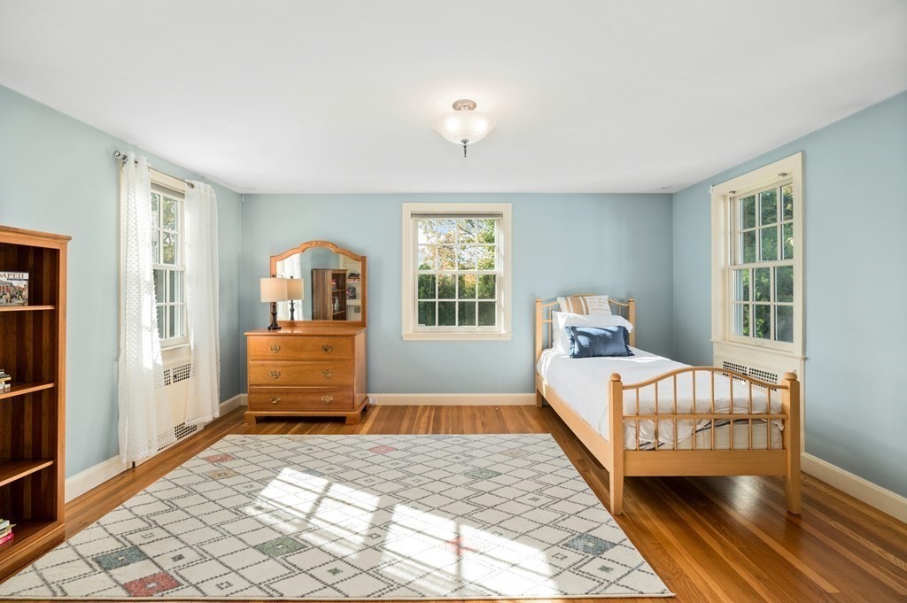 25 Haven Way Beverly, MA 01915 - Photo 25 of 42 a bedroom with a bed and wooden floor