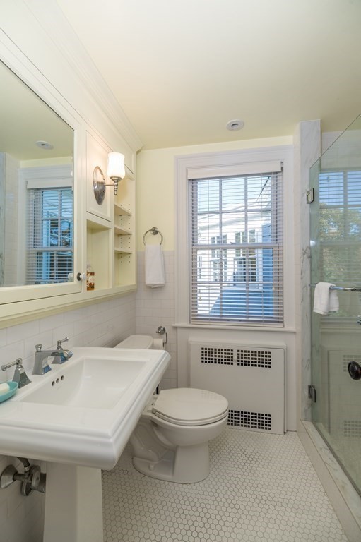 25 Haven Way Beverly, MA 01915 - Photo 26 of 42 a bathroom with a sink a toilet and a large mirror