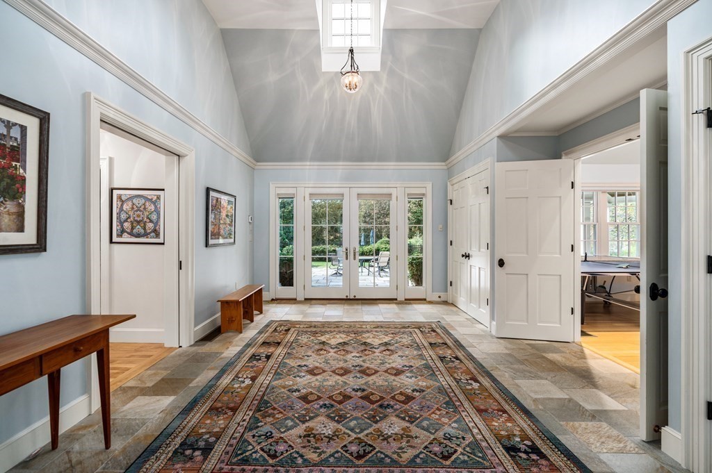 25 Haven Way Beverly, MA 01915 - Photo 35 of 42 a spacious bedroom with a large bed and a chandelier