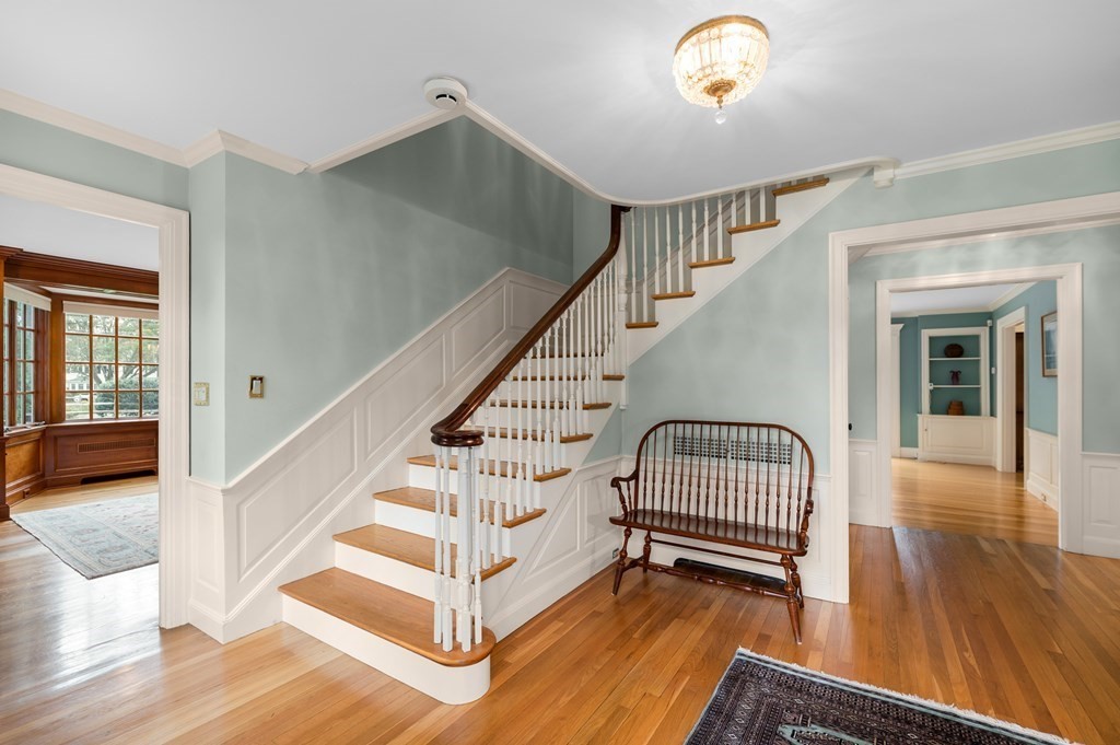 25 Haven Way Beverly, MA 01915 - Photo 7 of 42 a view of staircase with wooden floor and a chandelier