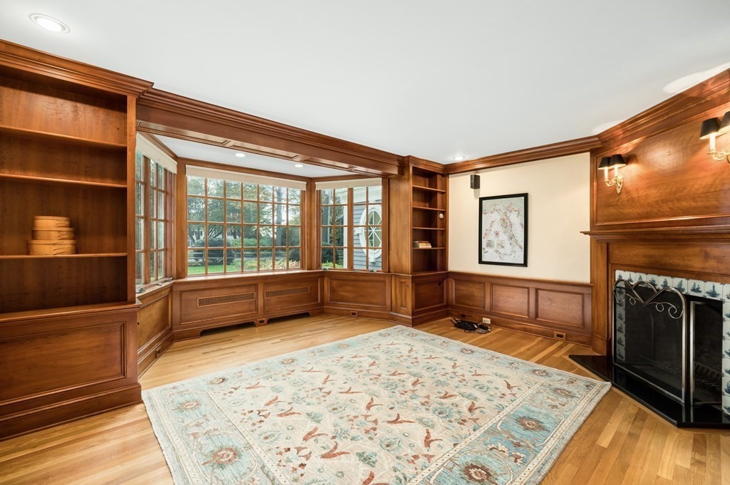 25 Haven Way Beverly, MA 01915 - Photo 8 of 42 a view of a livingroom with wooden floor and a fireplace