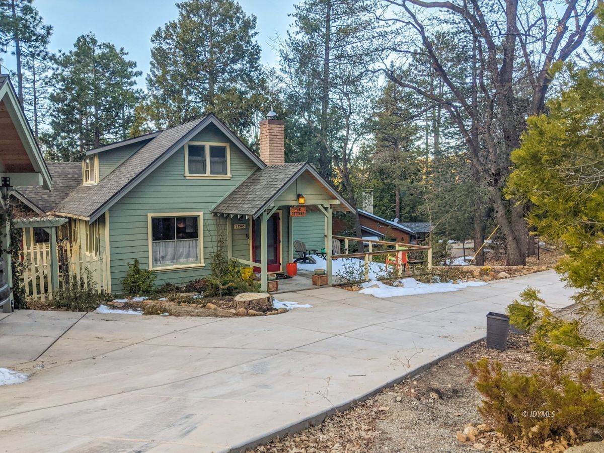 25505 Seneca Road Idyllwild, CA 92549 - Photo 3 of 60 a front view of a house with a yard and garage